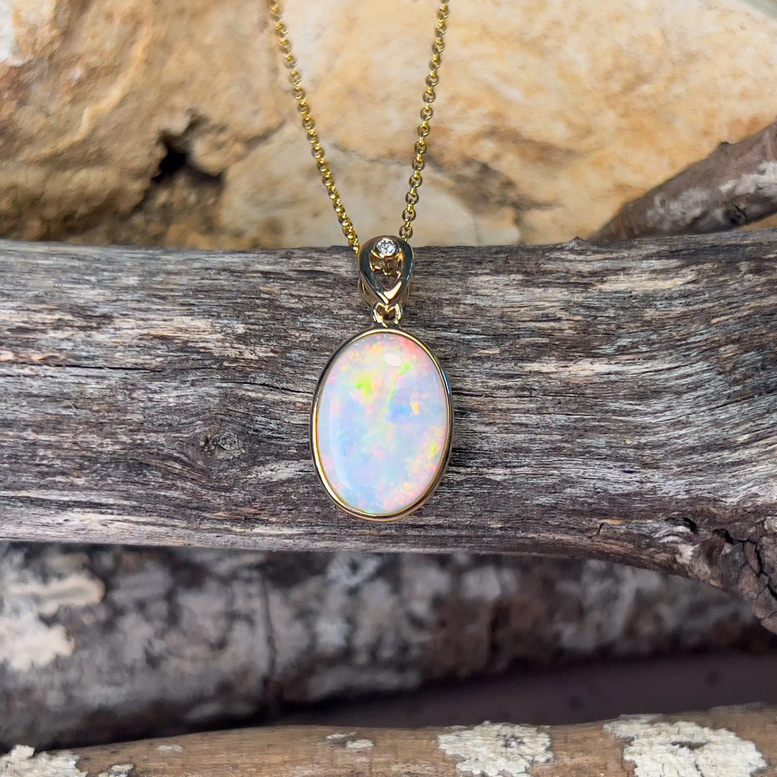 14kt Yellow Gold Oval White Opal Red 2.25ct bezel set pendant