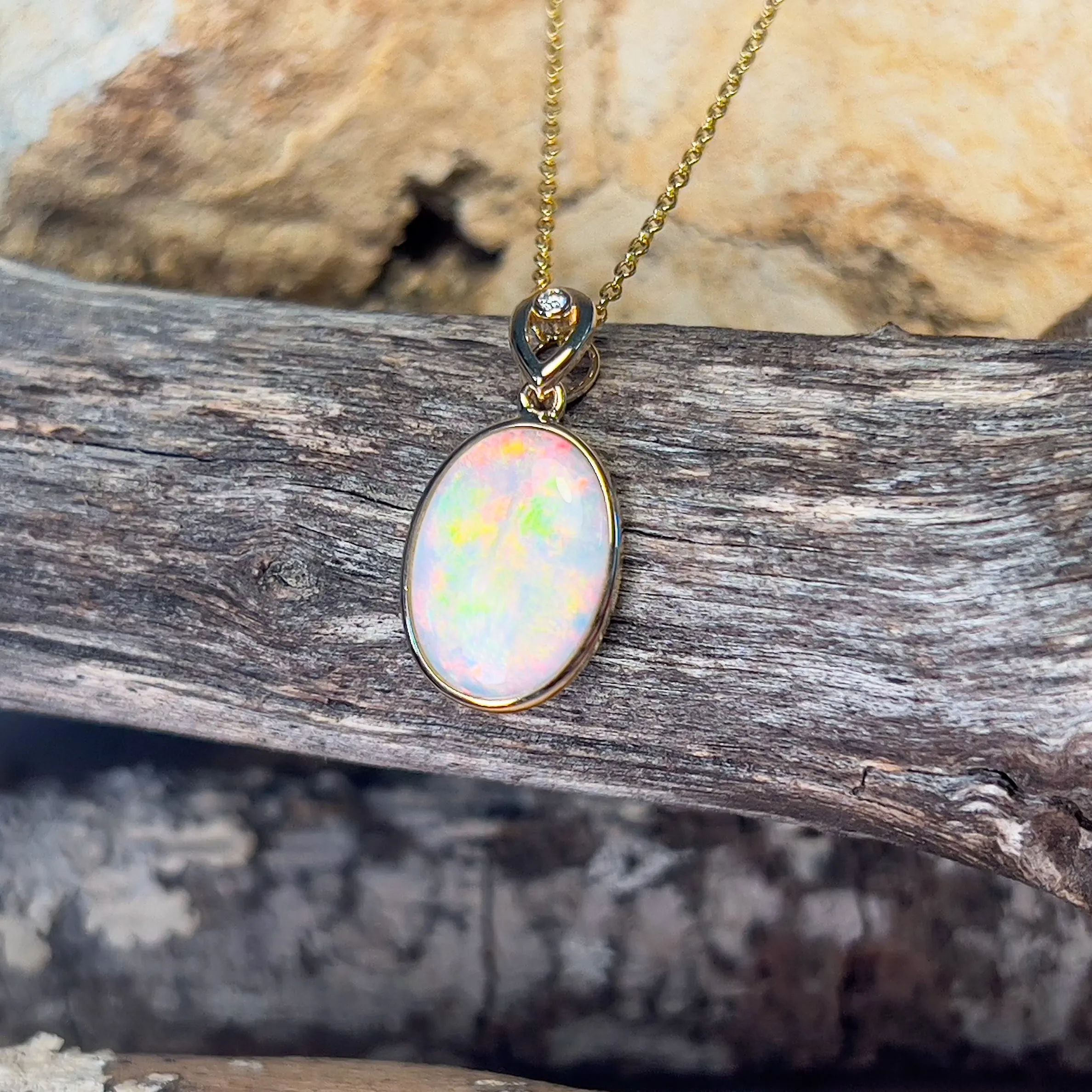 14kt Yellow Gold Oval White Opal Red 2.25ct bezel set pendant