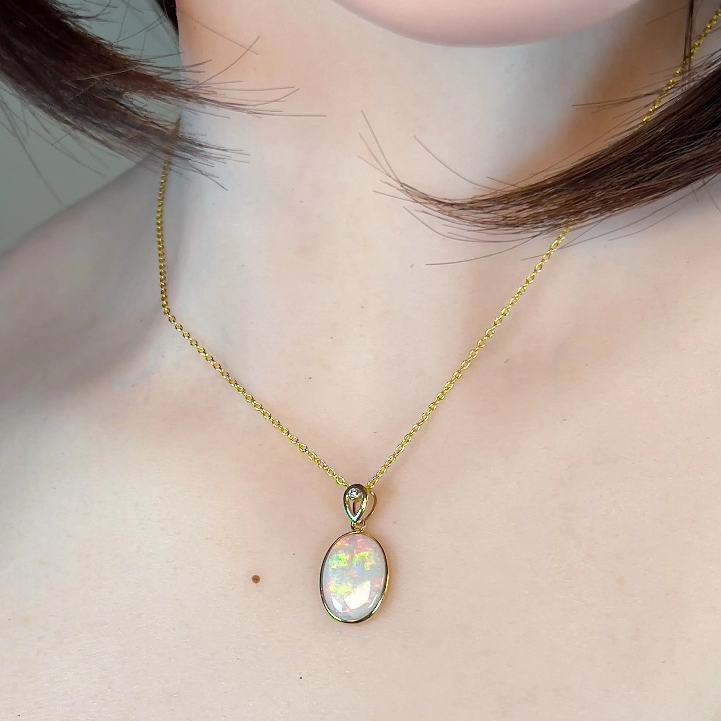 14kt Yellow Gold Oval White Opal Red 2.25ct bezel set pendant