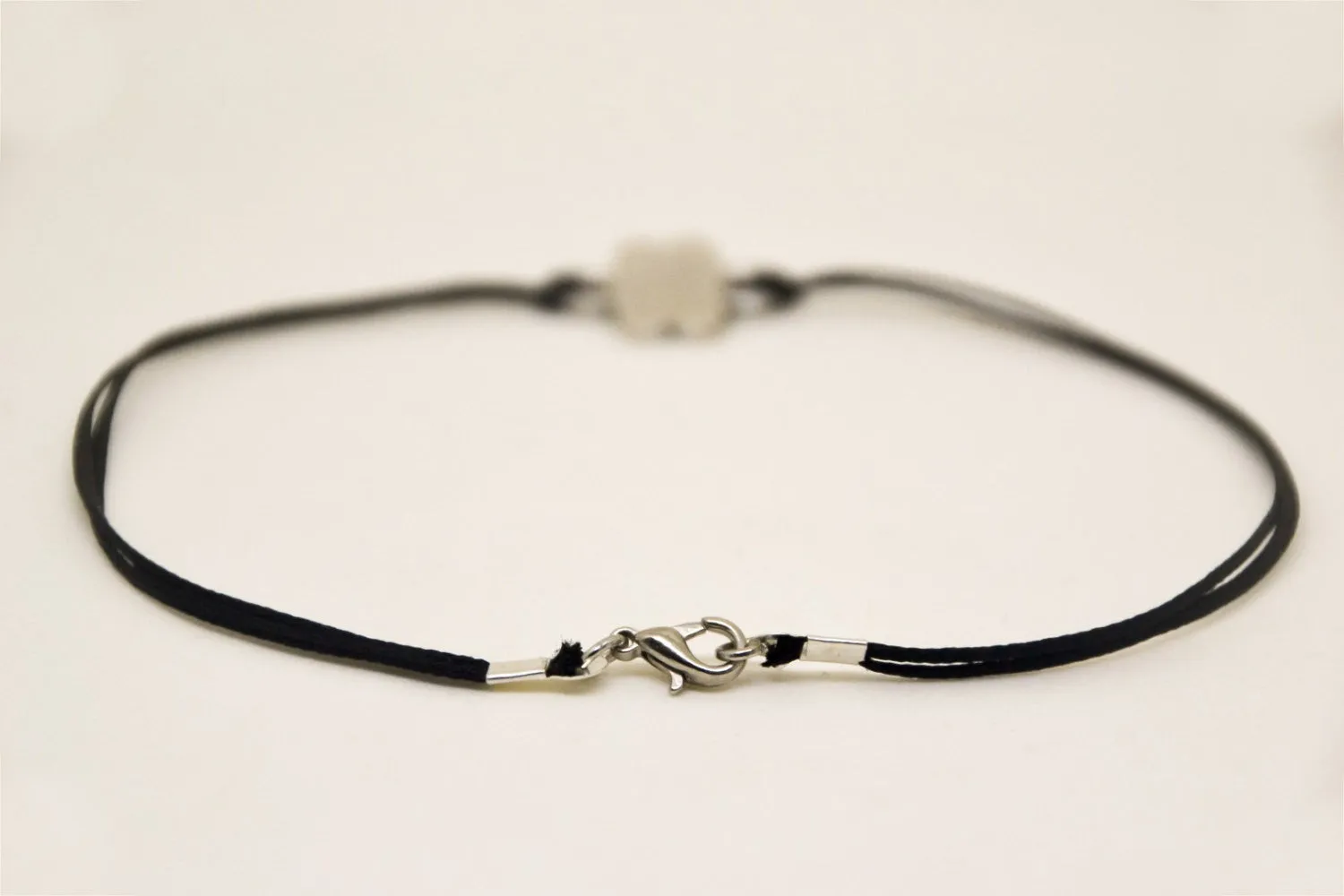 Silver Celtic knot infinity anklet for men, black cord